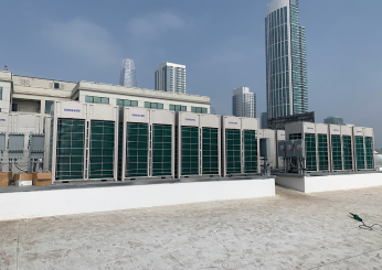 Row of VRF condenser units installed on a high-rise rooftop