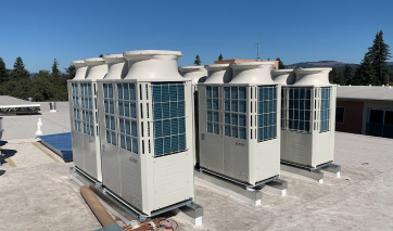 Three high-efficiency condensing units on a commercial roof